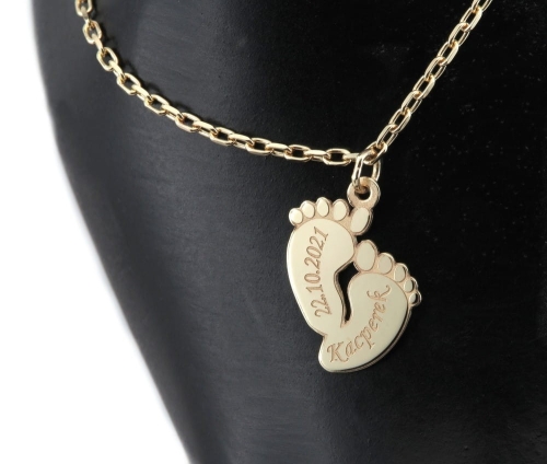 Złota bransoleta stopki