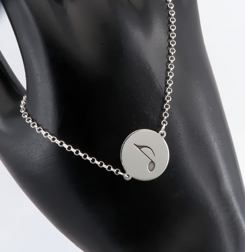 Srebrna bransoletka z nutką w krążku