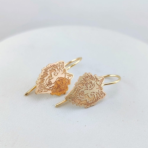 Złote kolczyki z wilkiem