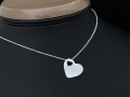 Srebrna zawieszka serce z wyciętym małym serduszkiem
