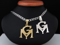 Zawieszki złota i srebrna -symbol GM