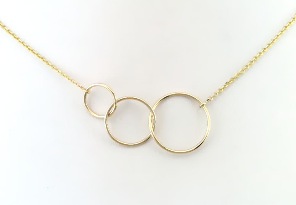 Złoty naszyjnik trzy przeplecione koła