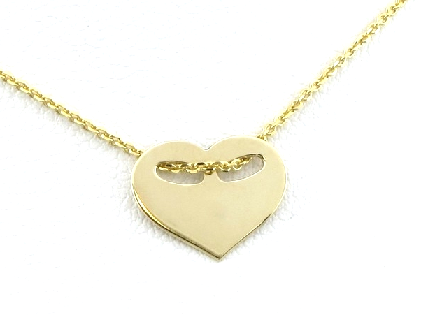 złota zawieszka serduszko z owalnymi otworkami