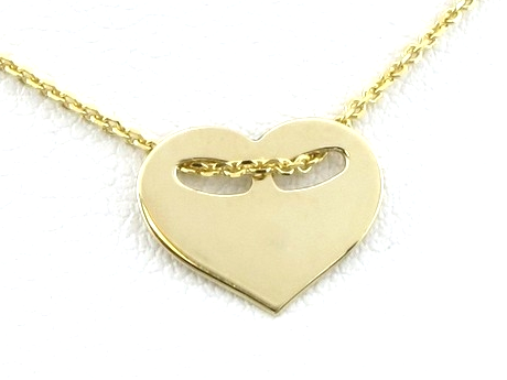 złota zawieszka serduszko z owalnymi otworkami